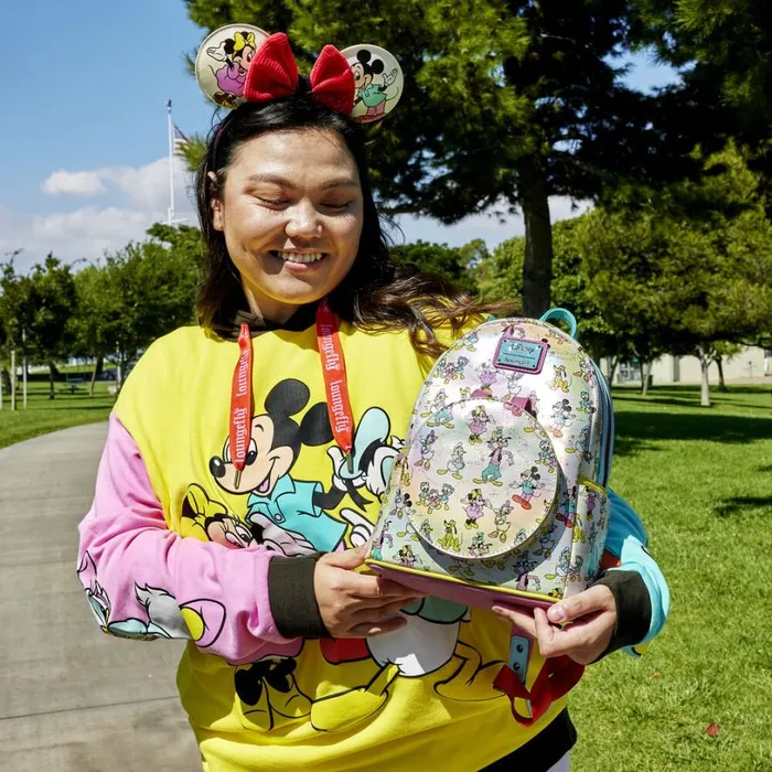 Disney100 Mickey and Friends Classic AllOver Print Iridescent Mini Backpack With Ear Headband Unisex Loungefly Backpacks Disney100 Mickey and Friends Classic AllOver Print Iridescent Mini Backpack With Ear Headband Unisex Loungefly Backpacks
